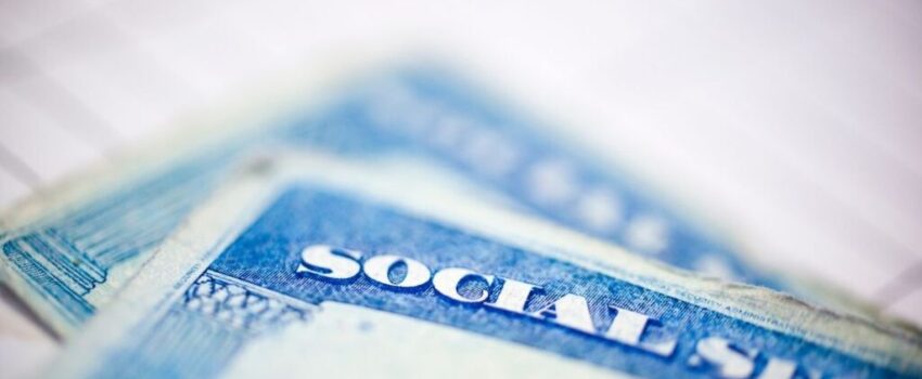 Social security cards with a blurry background.