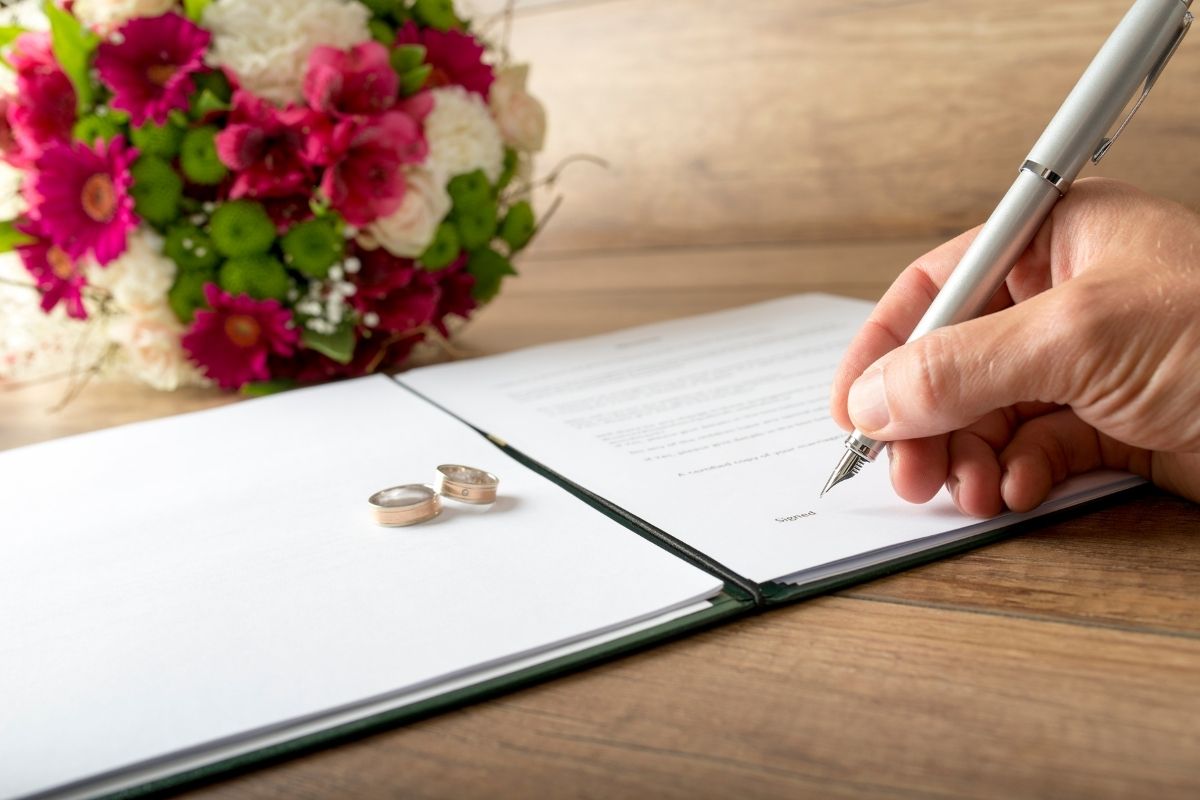 image1 Women writing her name in a document to change her name after marriage