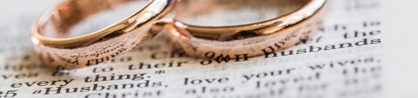 2 marriage rings placed in a legal documents after changing the spouse name