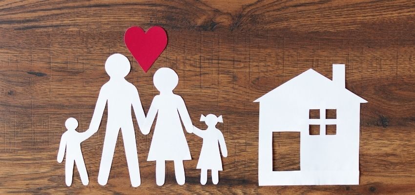 A paper cut-out representing a family with two kids.