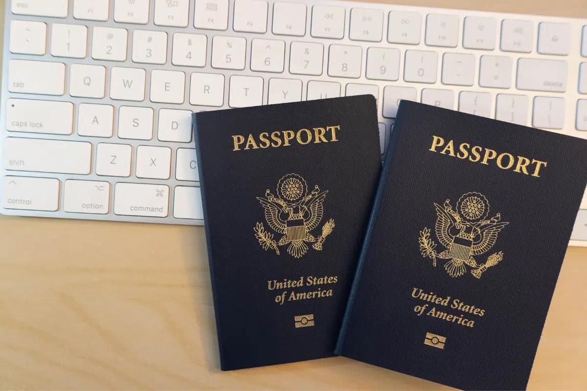 Two new US passports that were recently replaced after being damaged.