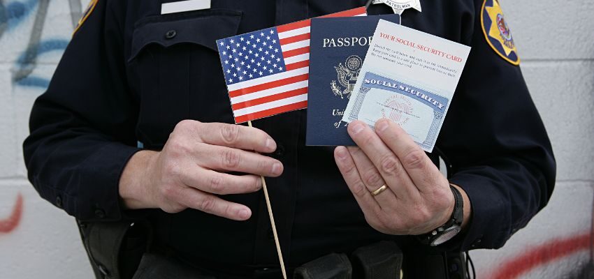 A person holds his requirements to get a green card in the USA through employment.